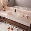 A modern bathroom vanity with a sink, faucet, and storage drawers, set against a tiled wall and floor. Anteprima dell’immagine prodotto