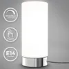 A white cylindrical table lamp with a silver base on a gray background. Produktbild-Vorschau