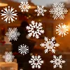 Snowflake window stickers are displayed on a window with a blurred background of a store interior. Produktbild-Vorschau