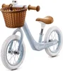 A light blue balance bike with a brown basket and seat, shown against a white background. Produktbild-Vorschau