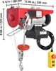 A red electric hoist with a hook and a yellow remote control, shown against a white background with dimension lines and measurements. Voir les images du produit