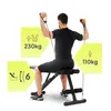 A man is using a black fitness bench with resistance bands attached. Náhľad obrázku produktu