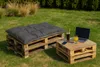 Outdoor seating area with pallet furniture, drinks, and a laptop. Produktbild-Vorschau