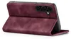 A burgundy flip case for a smartphone is shown from a diagonal, slightly elevated angle, with the front cover open and folded back. Produktbild-Vorschau