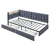 A gray upholstered daybed with a metal frame and two storage drawers underneath. It has a small wooden shelf with a USB and Type-C port at the headboard. Náhled obrázku produktu