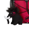 A close-up of a stuffed mammoth toy attached to a red backpack. Produktbild-Vorschau