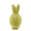 A yellow ceramic Easter bunny figurine with white polka dots, viewed from the back. Produktbild-Vorschau