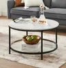 A round coffee table with a marble-like top and a glass shelf is placed in a living room setting. Produktbild-Vorschau