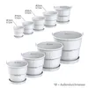 A diagram showing multiple sizes of white plant pots with their dimensions labeled. Produktbild-Vorschau
