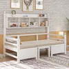 A white wooden daybed with a bookshelf headboard is shown against a white brick wall. Náhled obrázku produktu