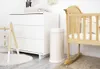 A nursery room with a crib, dresser, and diaper pail. Náhľad obrázku produktu