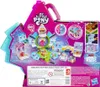 The back of a My Little Pony Mini World Magic Epic CB playset packaging, showing the opened box with the playset components laid out. Produktbild-Vorschau
