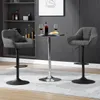 Two dark gray bar stools are placed around a small round table in a modern living room setting. Produktbild-Vorschau