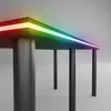 A close-up, angled view of a modern desk with integrated LED lighting. Produktbild-Vorschau