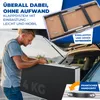 A man loading a folded table into the trunk of a car. Produktbild-Vorschau