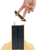 A fingerboard is being held by fingers above a ramp set. Voir les images du produit