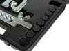 A close-up view of a tool kit, showing various metal and plastic components organized within a black case. Náhled obrázku produktu