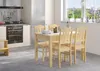 A kitchen and dining area with a wooden table and chairs set up near a window. Produktbild-Vorschau