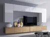 A modern living room wall unit with a TV and decorative items. Produktbild-Vorschau