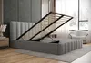 A bedroom scene with a bed with its storage compartment open, a nightstand, and a chair near a window. Produktbild-Vorschau