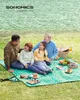 A family having a picnic by a lake. Produktbild-Vorschau