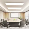A modern conference room with a long table, chairs, and a projector screen. Produktbild-Vorschau