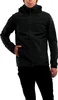 A man wearing a black jacket and black pants, with his hand in his pocket. Produktbild-Vorschau