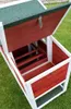 A wooden chicken coop with the roof open, sitting on green grass. Produktbild-Vorschau