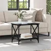 A black side table with a shelf is placed next to a sofa in a living room. Podgląd zdjęcia produktu