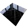 A single black marble-like tile with white veins, presented diagonally on a white background. Anteprima dell’immagine prodotto