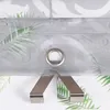 A close-up of a curtain with a leaf pattern and a metal grommet. Produktbild-Vorschau