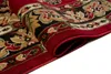 A close-up view of a rolled-up rug with a classic pattern. Náhled obrázku produktu