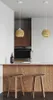 A modern kitchen island with two stools and pendant lights. Produktbild-Vorschau