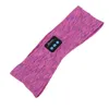 A purple and pink heathered fabric headband with a small black control module embedded in it. Náhled obrázku produktu