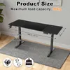 A black standing desk is shown with dimensions and load capacity indicated by text overlays. Náhled obrázku produktu