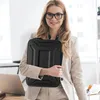 A woman in a business suit holding a black laptop bag. Produktbild-Vorschau