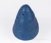 A blue mushroom-shaped lamp with small holes is shown against a white background. Produktbild-Vorschau