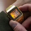 A close-up shot of a person's wrist wearing a gold Casio digital watch. Produktbild-Vorschau