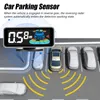 A car parking sensor display showing distance and a graphical representation of the car and its surroundings. Podgląd zdjęcia produktu
