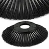 A close-up view of a black sweeping brush head, with a second brush head slightly out of focus in the background. Produktbild-Vorschau