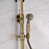 A close-up of a vintage-style brass shower fixture with water spraying from the hand shower. Náhled obrázku produktu