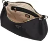 An open black Guess hobo shoulder bag is shown from a slightly elevated angle, revealing its interior. Produktbild-Vorschau