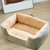 A pet bed on a wooden floor, with a framed picture in the background. Produktbild-Vorschau