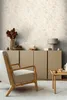 A living room scene with a chair, cabinet, and side table. Produktbild-Vorschau