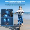 A woman riding an electric bicycle on a beach. Voir les images du produit