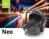 A black baby car seat is shown in front of a blurred background of city lights at night. Náhľad obrázku produktu