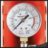 A close-up of a pressure gauge on a red device. Produktbild-Vorschau