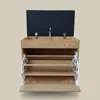A wooden shoe cabinet with a black upholstered seat on top, and open shelves below. Náhľad obrázku produktu