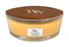 A WoodWick candle with a wooden lid and a label. Voir les images du produit