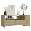 A wooden TV stand with decorative items on top. Náhled obrázku produktu